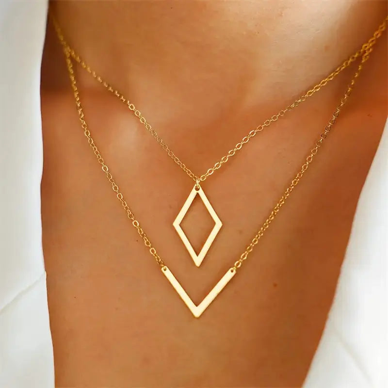 Elegant necklace with geometric V-shaped pendant.