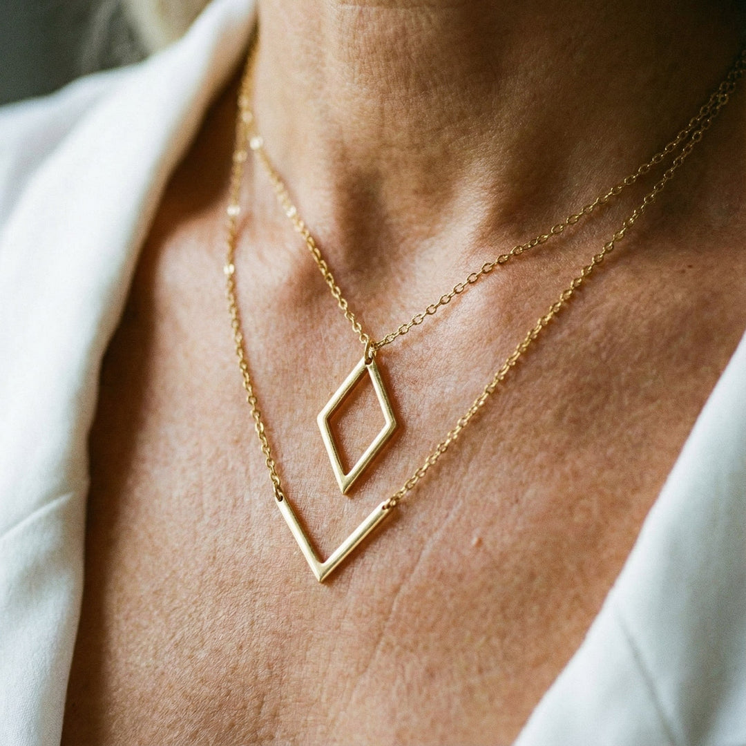 Elegant necklace with geometric V-shaped pendant.